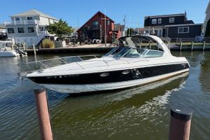Formula 330 Sun Sport 2004 Formula 330 Sun Sport boat docked in a residential marina.