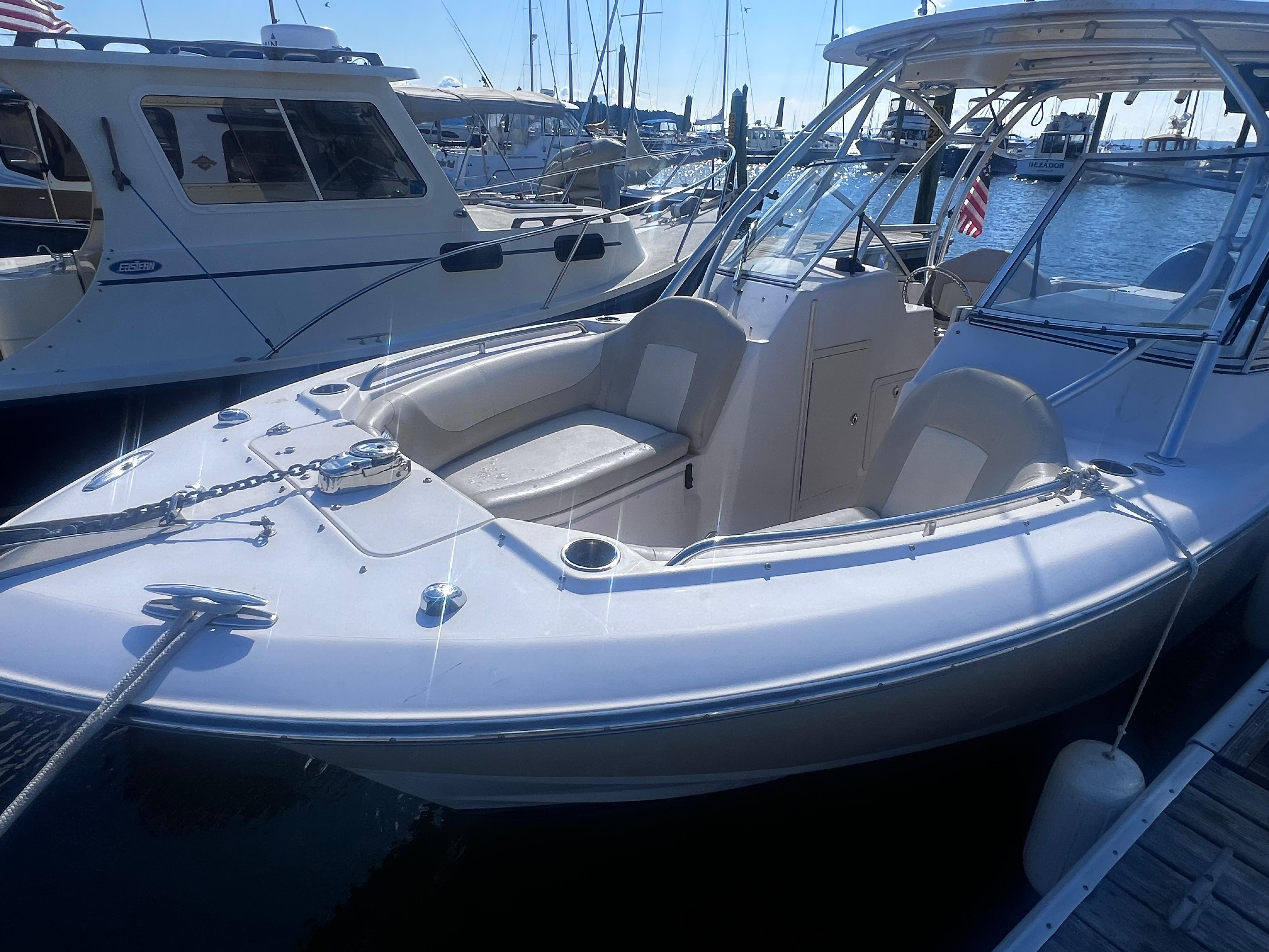 Grady-White Freedom 275 2012 Grady-White Freedom 275 boat docked at marina, featuring spacious seating and sleek design.