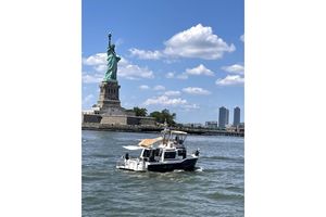 Ranger Tugs 43-CB 2022 Ranger Tugs 43-CB boat near Statue of Liberty on a sunny day.