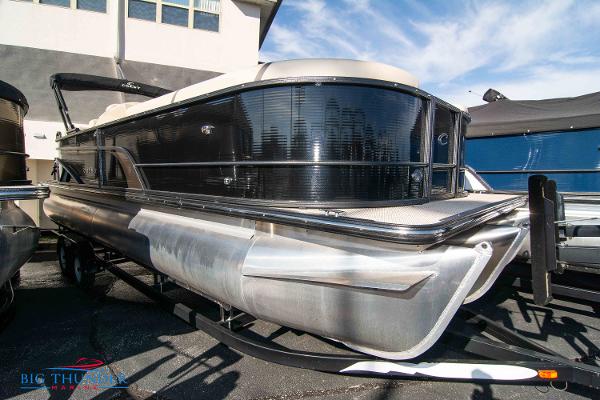 Crest Classic Platinum 240 SLC 2023 Crest Classic Platinum 240 SLC pontoon boat on trailer.