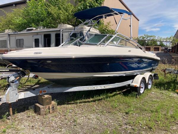 Sea Ray 205 Bow Rider 2008 Sea Ray 205 Bow Rider boat on trailer, parked outdoors.