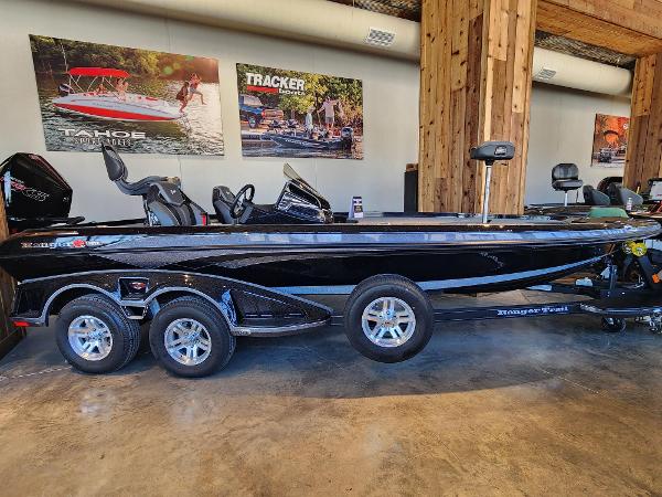 Ranger Z520R 2024 Ranger Z520R bass boat in showroom, black finish, triple-axle trailer.