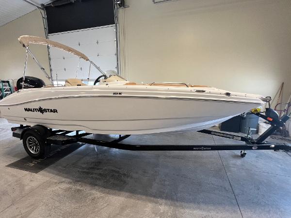 NauticStar 203 SC Deck 2025 NauticStar 203 SC Deck boat on trailer in indoor storage.
