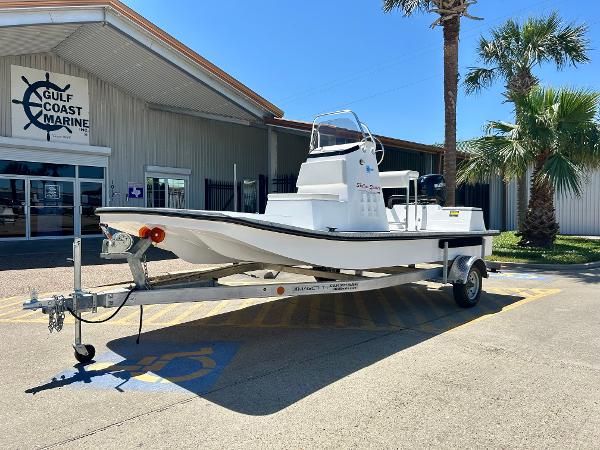 Shallow Stalker 17 LTS 2024 Shallow Stalker 17 LTS boat on trailer at Gulf Coast Marine dealership.