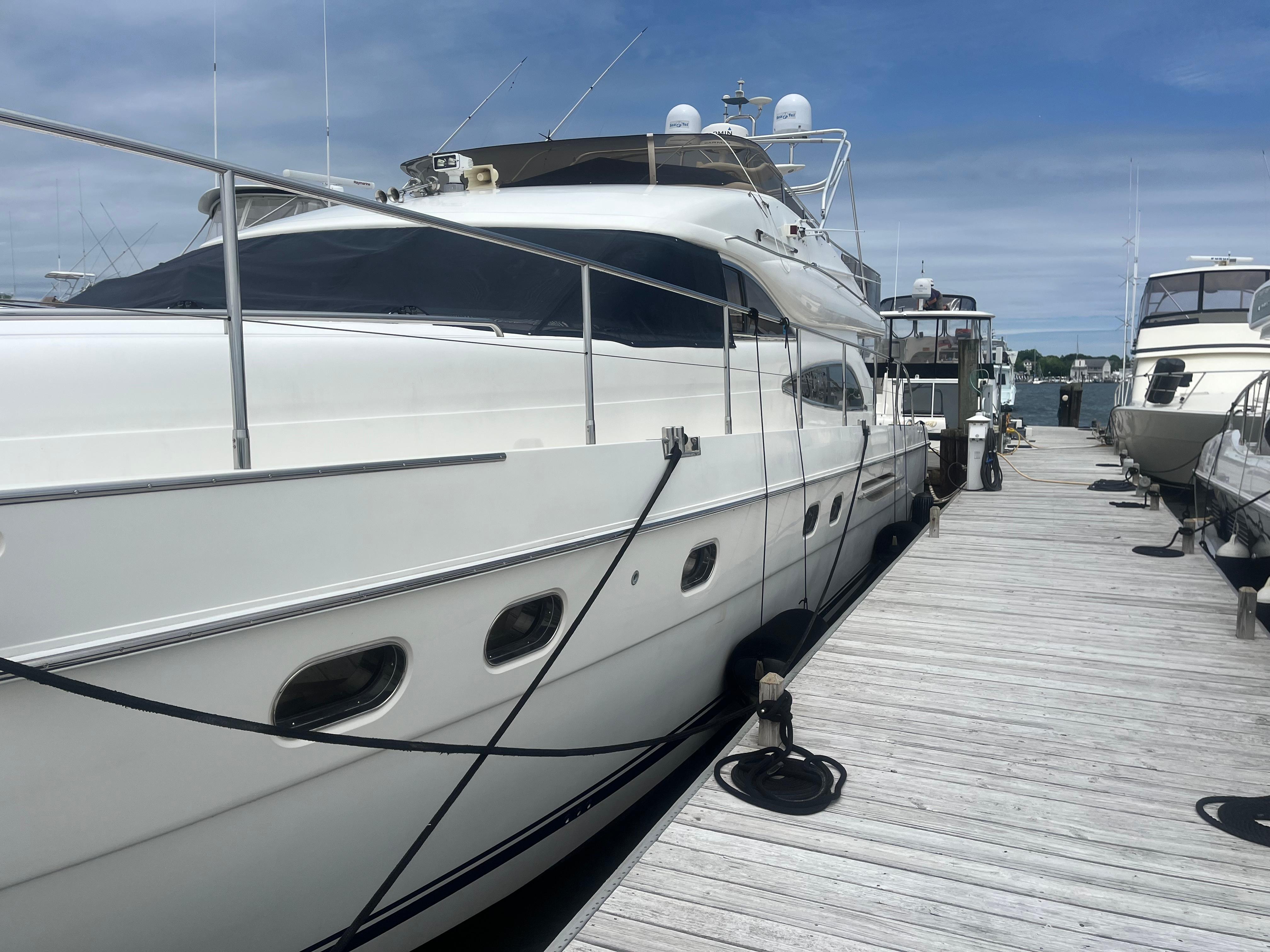 Princess 65 M/Y Luxury Princess 65 M/Y yacht docked at marina, 2000 model, clear sky background.