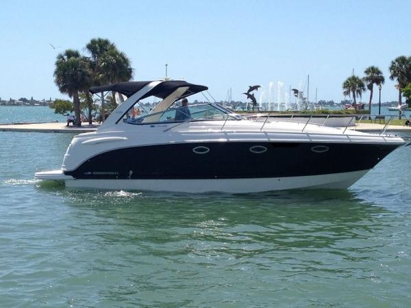 Chaparral 370 Signature 2008 Chaparral 370 Signature boat cruising on a sunny day near palm trees.