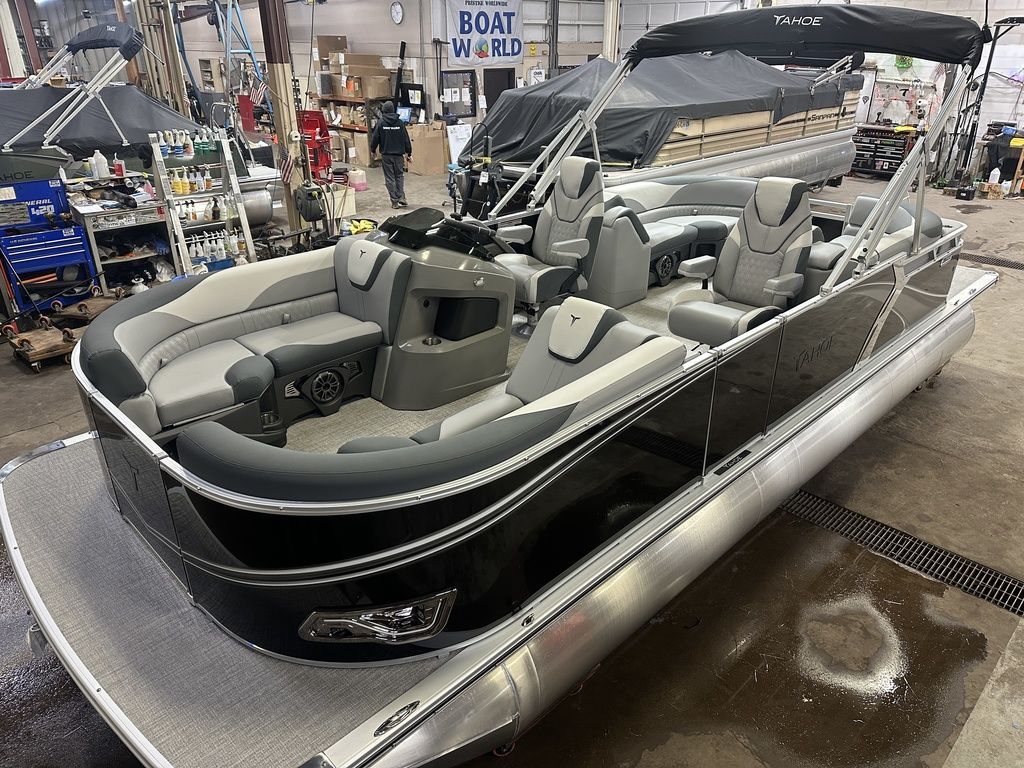 Tahoe LTZ 2385 Quad Lounge & Honda 4-Stroke EFI 2025 Tahoe LTZ 2385 Quad Lounge pontoon boat in a workshop setting.