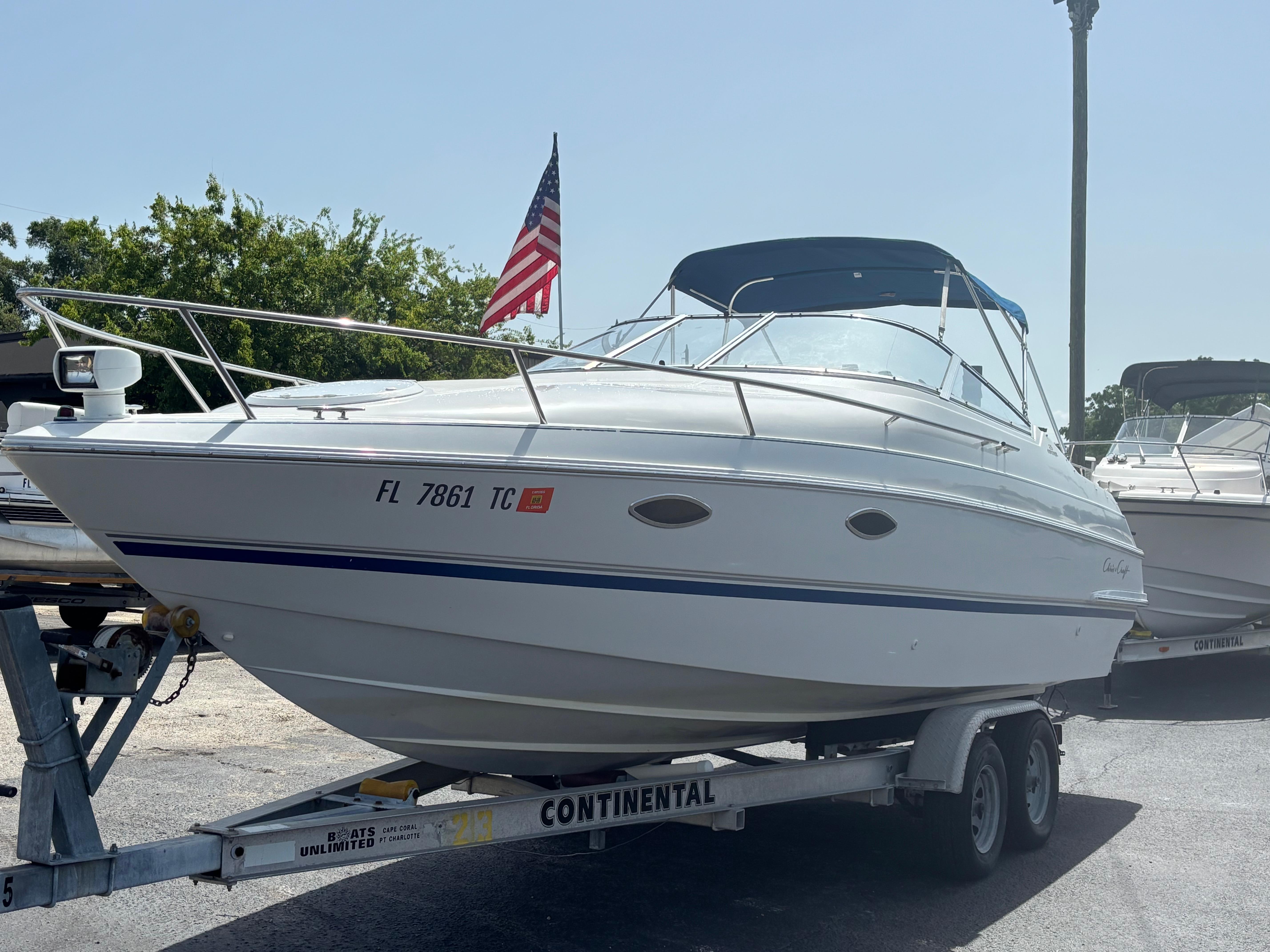 Chris-Craft 25 Concept 1996 Chris-Craft 25 Concept boat on trailer with American flag in background.