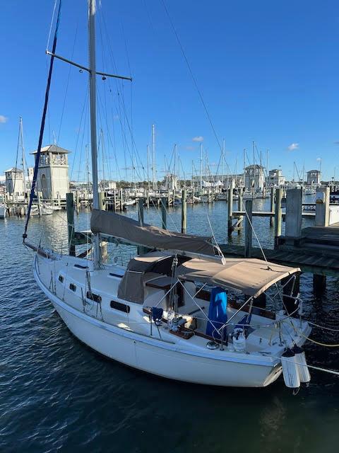 Allied Seawind 1977 Allied Seawind sailboat docked at a marina under clear blue skies.