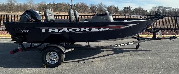 Tracker Pro Guide V-16 SC 2025 Tracker Pro Guide V-16 SC boat on trailer, parked outdoors.