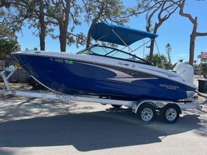 Monterey M-205 2022 Monterey M-205 boat on trailer with blue canopy, parked outdoors.