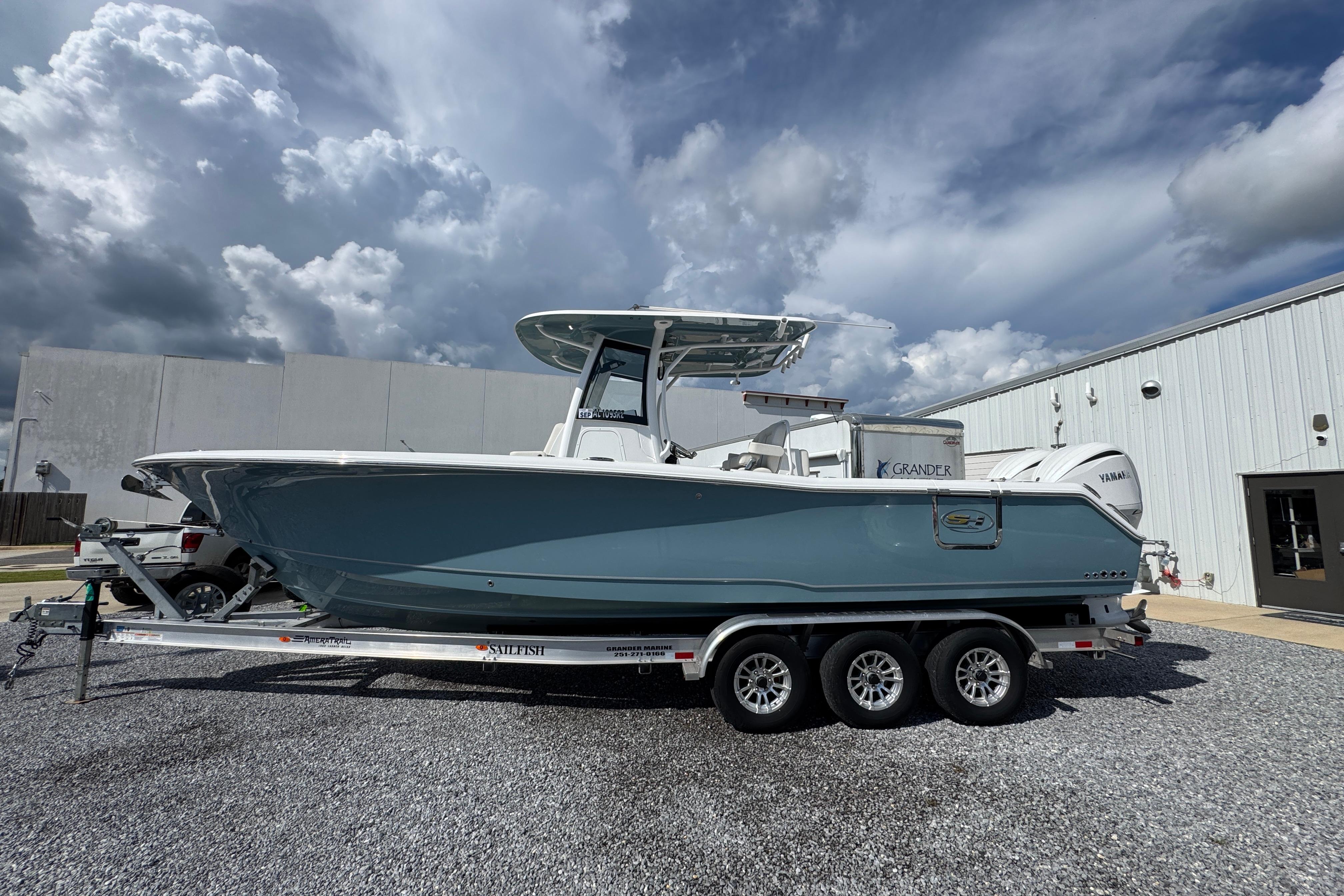 Sea Hunt Gamefish 30 Coffin Box 2023 Sea Hunt Gamefish 30 Coffin Box boat on trailer, parked outdoors.