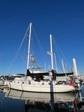 Gulfstar 50 1978 Gulfstar 50 sailboat docked in marina under clear blue sky.
