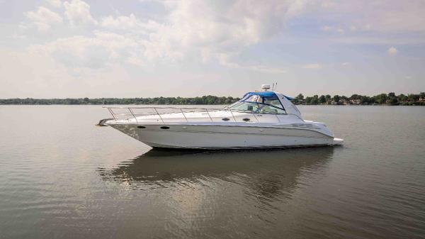 Sea Ray Sundancer 400 1998 Sea Ray Sundancer 400 yacht on calm water under a cloudy sky.