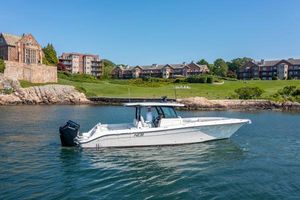 HCB 39 Speciale 2024 HCB 39 Speciale boat cruising near waterfront homes.