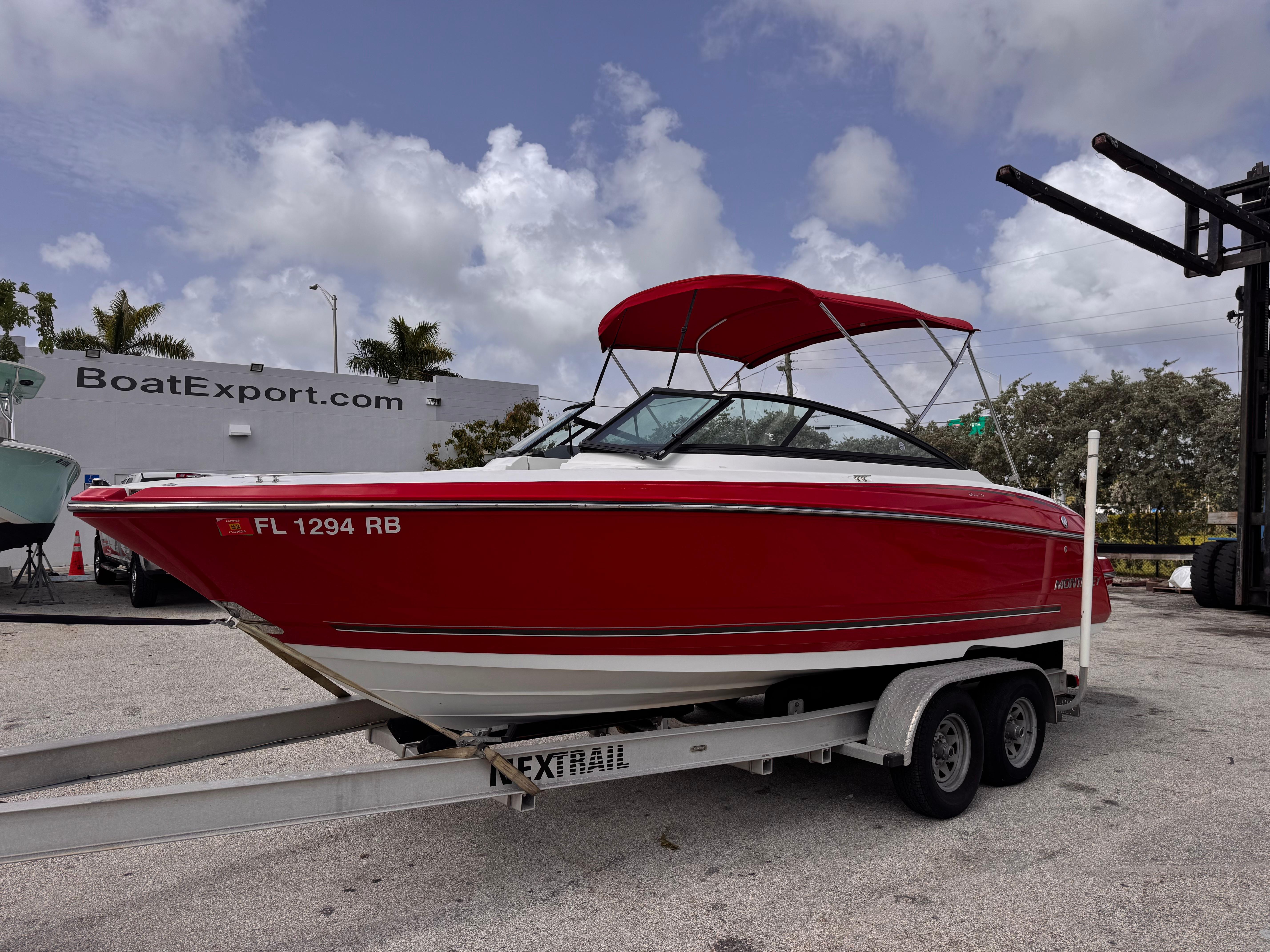 Monterey 244FS 2016 Monterey 244FS boat with red hull on trailer at BoatExport.com.
