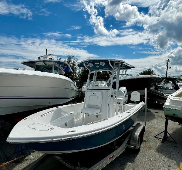 Sea Pro 202 Center Console 2024 Sea Pro 202 Center Console boat on trailer under a blue sky.