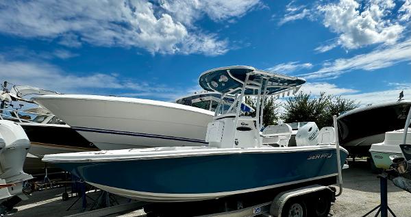 Sea Pro 202 Center Console 2024 Sea Pro 202 Center Console boat on trailer under blue sky.