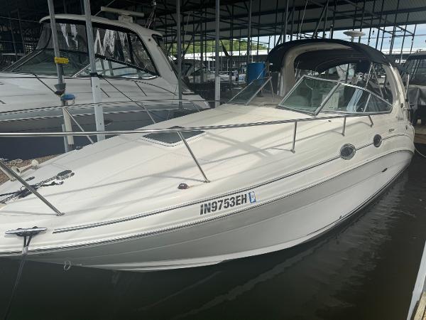 Sea Ray 280 Sundancer 2006 Sea Ray 280 Sundancer boat docked in marina, side view.