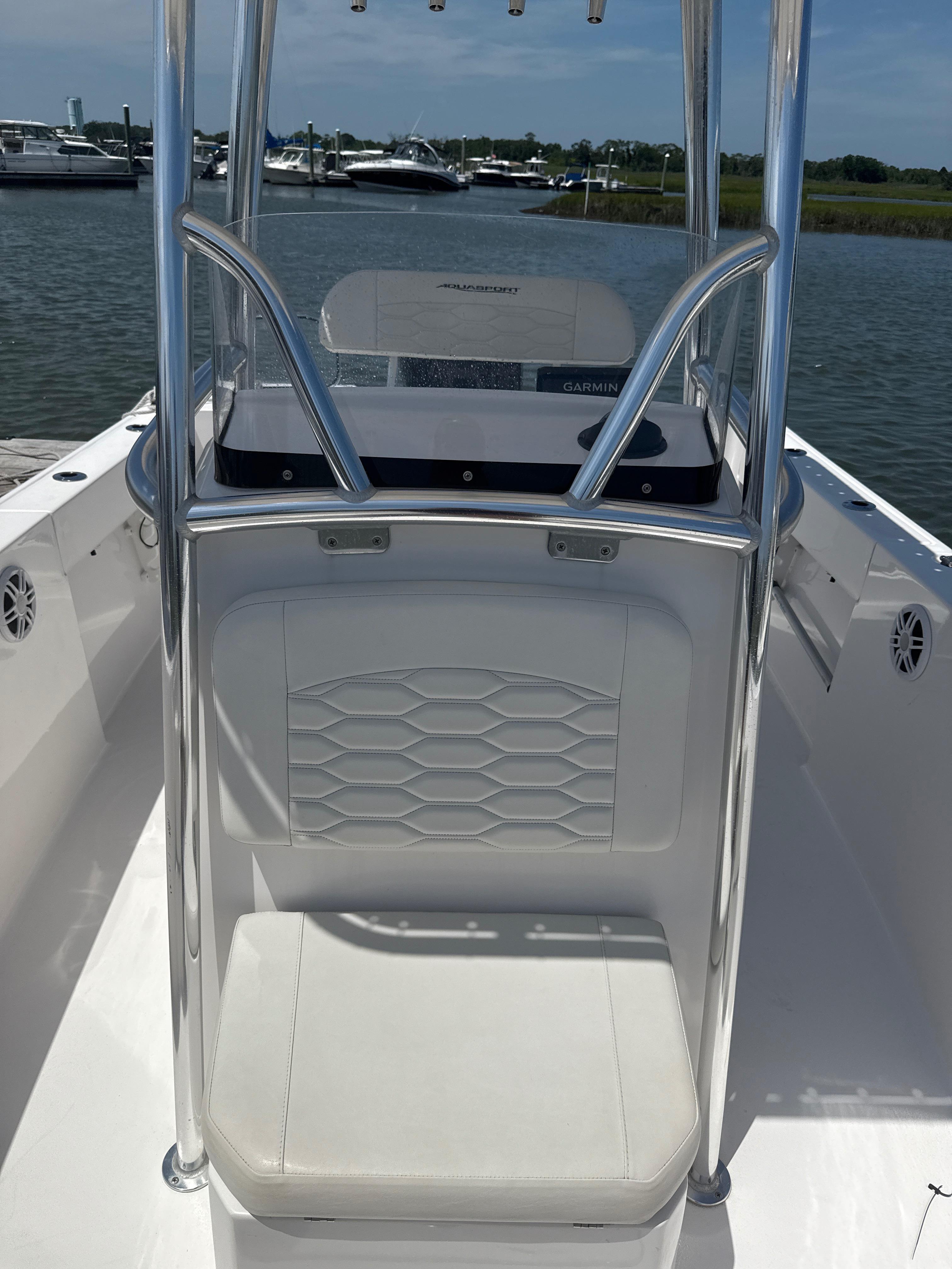 Aquasport 2200 Center Console 2024 Aquasport 2200 Center Console boat interior with seating and console view.