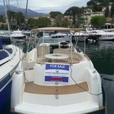 Jeanneau Leader 805 2003 Jeanneau Leader 805 boat for sale at marina, featuring spacious seating and canopy.