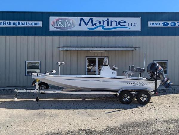 Xpress H210B 2025 Xpress H210B boat on trailer outside L&M Marine LLC building.
