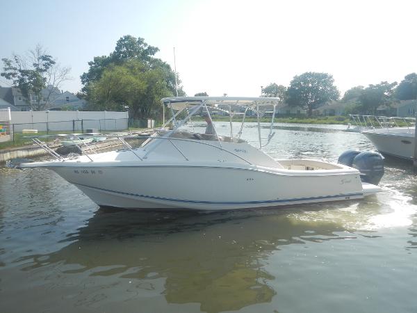 Scout 282 Abaco 2001 Scout 282 Abaco boat on calm water, side view, with trees in the background.