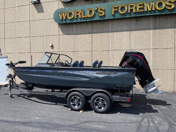 Ranger VX1988 WT 2024 Ranger VX1988 WT boat on trailer, parked outside a building.