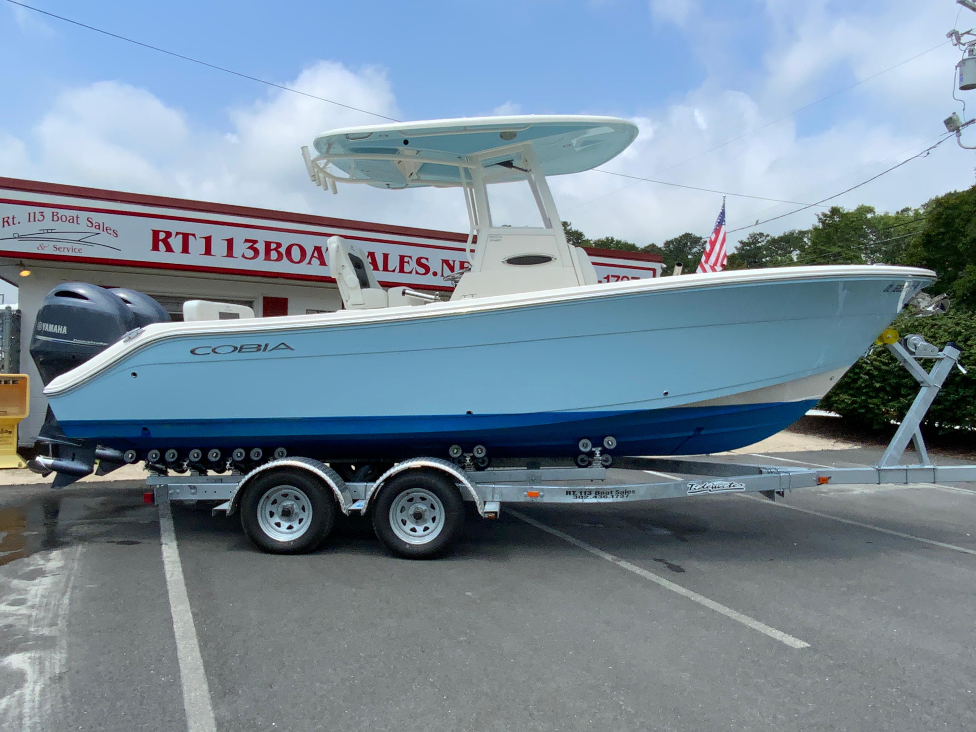 Cobia 240 Center Console 2023 Cobia 240 Center Console boat on trailer at dealership.
