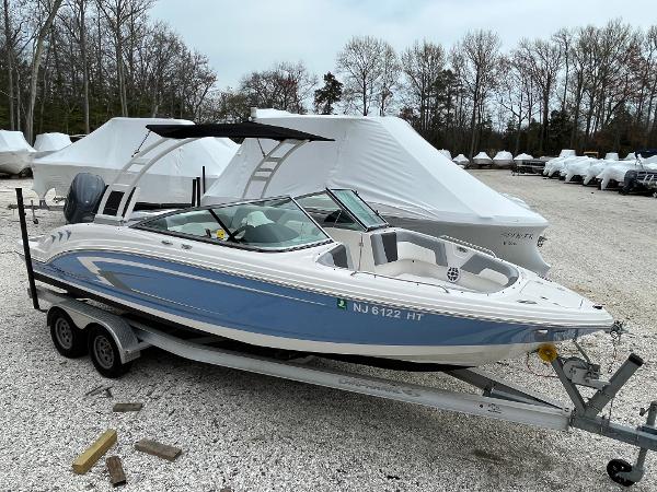 Chaparral 23 SSIOB 2023 Chaparral 23 SSIOB boat on trailer, parked outdoors.
