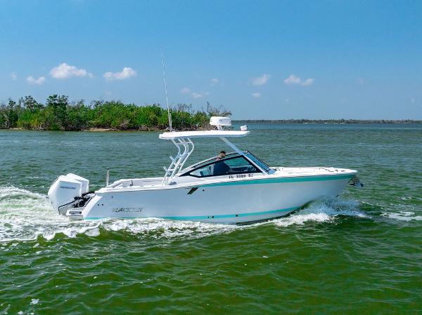 Blackfin 272 DC 2021 Blackfin 272 DC boat cruising on a sunny day in open water.