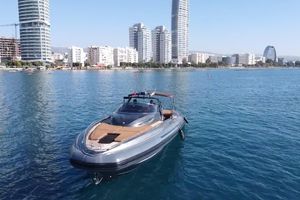 SACS Strider 18 2017 SACS Strider 18 yacht on calm water with city skyline backdrop.