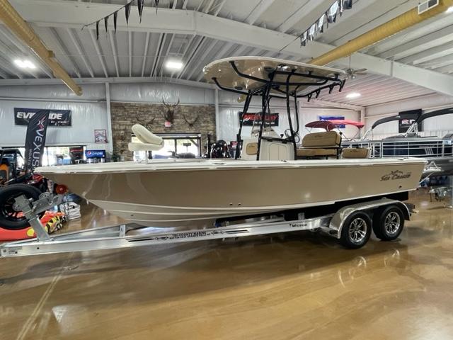 Sea Chaser LX 2024 Sea Chaser LX boat on trailer in showroom, side view.