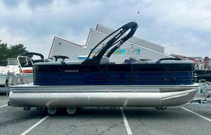 Berkshire 22RFX ARCH CTS 2.75 2025 Berkshire 22RFX ARCH CTS 2.75 pontoon boat on trailer, parked outdoors.