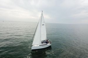 Bavaria Cruiser 34 2020 Bavaria Cruiser 34 sailing on calm ocean waters under cloudy skies.