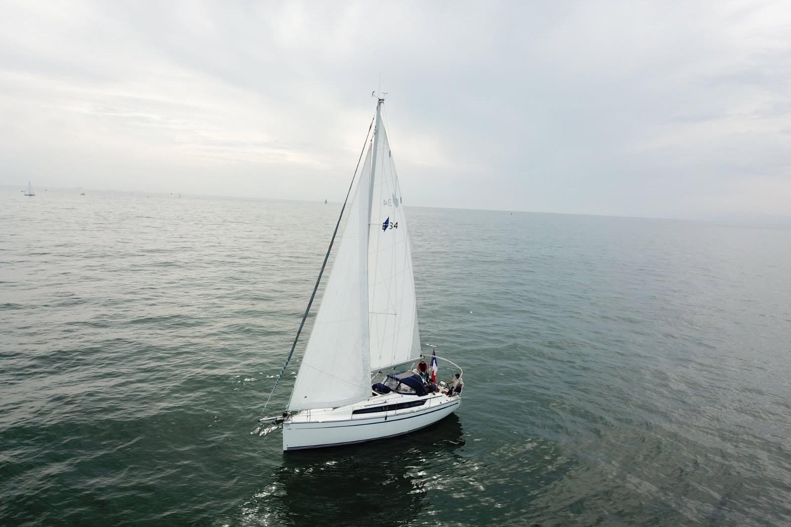 Bavaria Cruiser 34 2020 Bavaria Cruiser 34 sailing on calm ocean waters under cloudy skies.