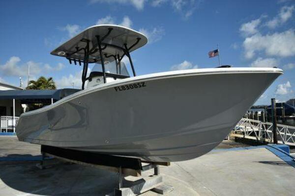 NauticStar 2302 Legacy 2022 NauticStar 2302 Legacy boat on display at a marina.