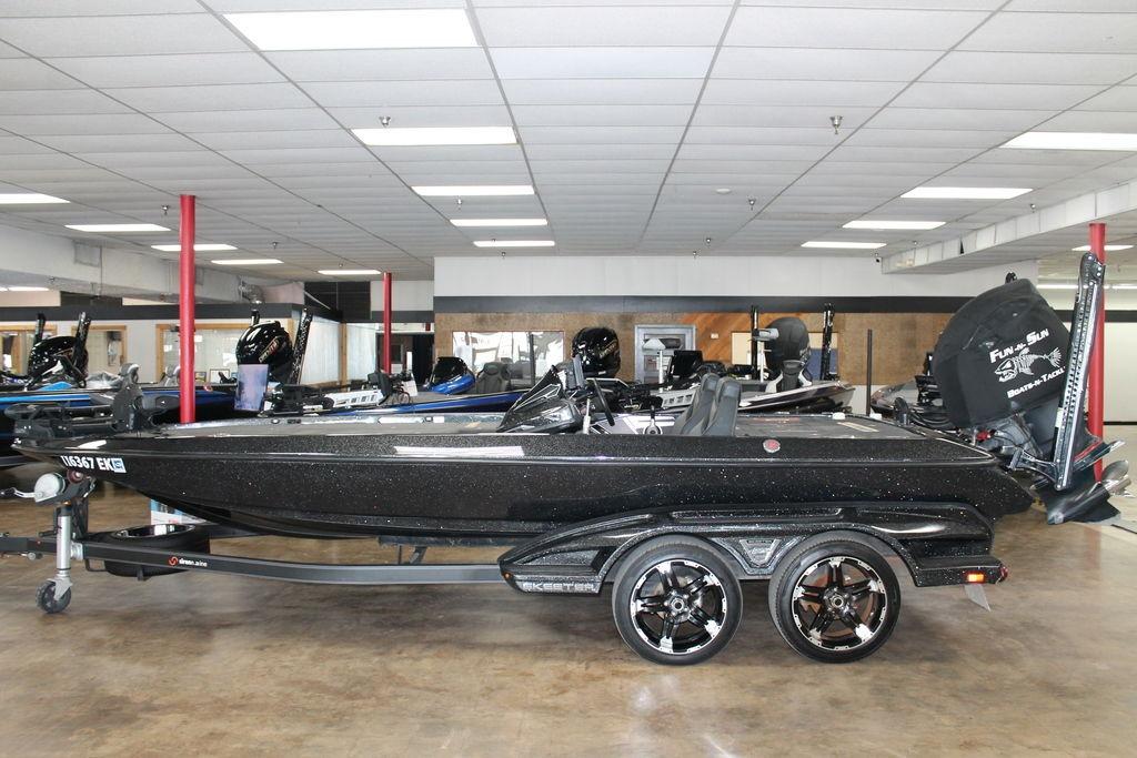 Skeeter FX21 Limited Edition 2019 Skeeter FX21 LE boat in showroom, black with trailer, side view.