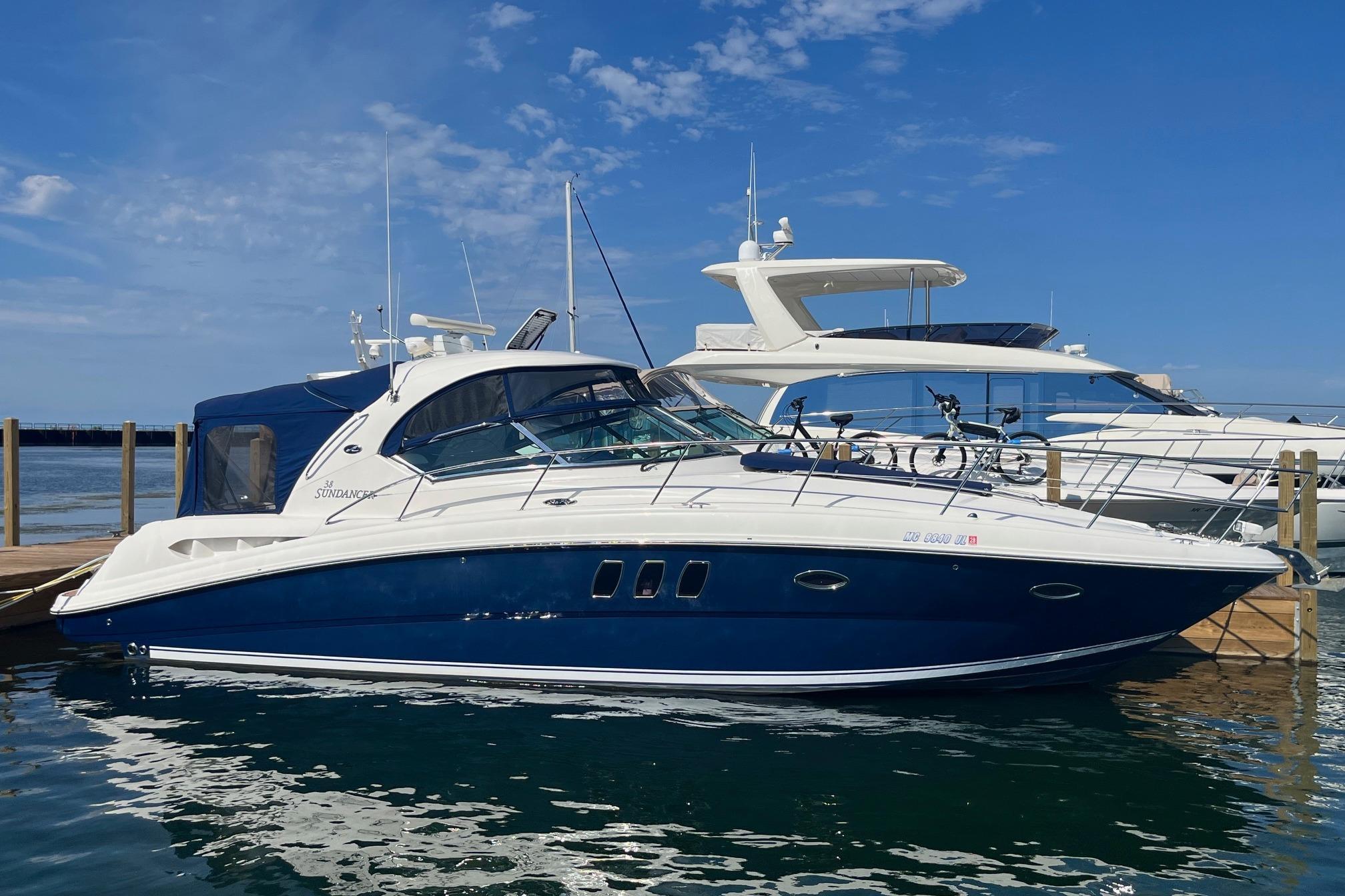 Sea Ray 380 Sundancer 2008 Sea Ray 380 Sundancer yacht docked at marina under clear blue sky.