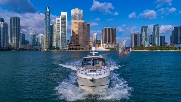 Princess V48 Open 2017 Princess V48 Open yacht cruising in front of a city skyline.