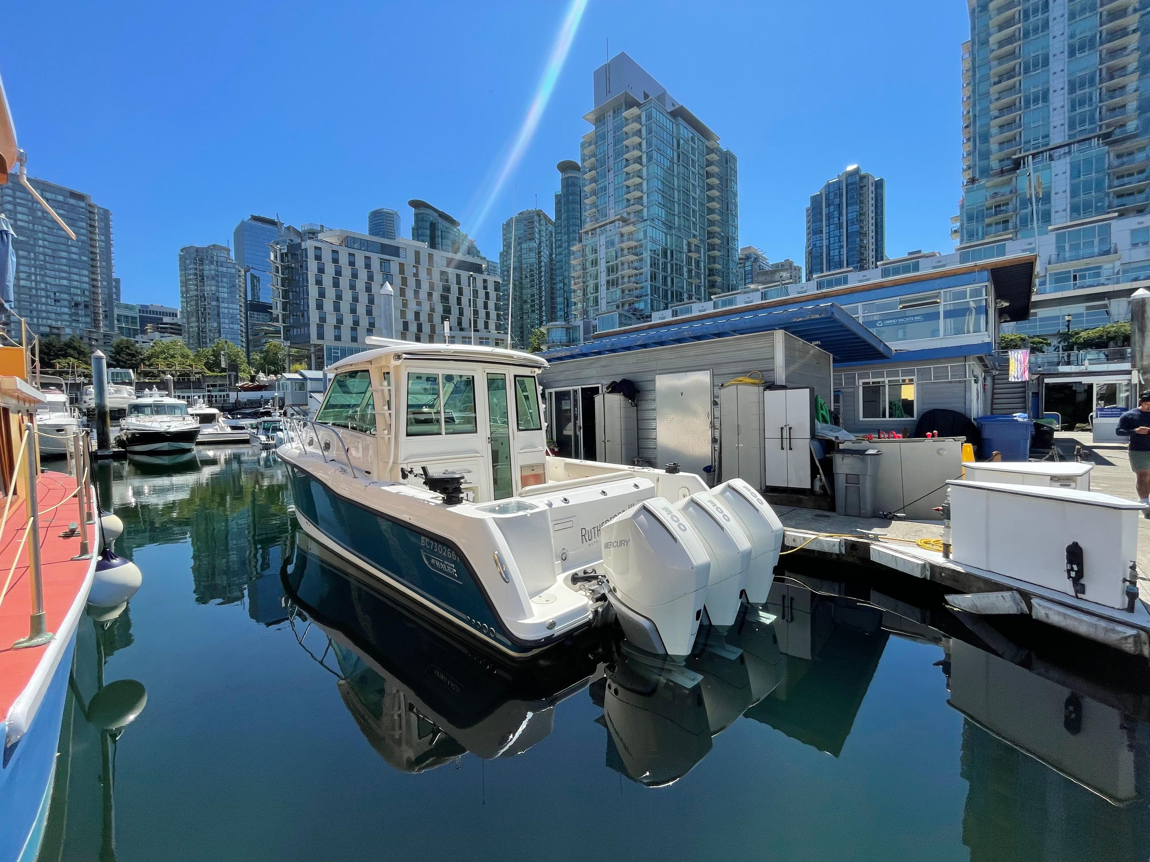 Boston Whaler 345 Conquest Pilothouse 2020 Boston Whaler 345 Conquest Pilothouse docked in urban marina setting.