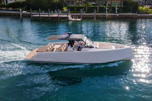 Pardo Yachts P43 2019 Pardo Yachts P43 cruising on clear blue water near a dock.