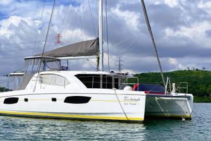 Leopard 44 2015 Leopard 44 catamaran sailing on calm waters under a cloudy sky.