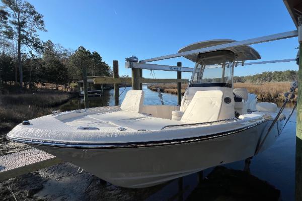 Grady-White 231 Coastal Explorer 2025 Grady-White 231 Coastal Explorer boat docked by a serene riverside.