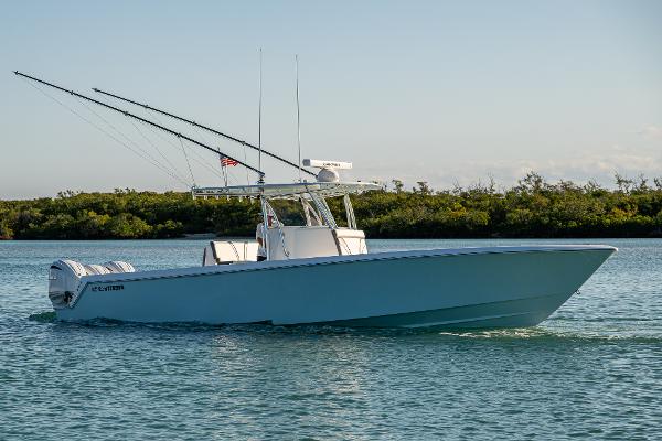 Contender 39 ST 2022 Contender 39 ST boat cruising on calm water with fishing rods.