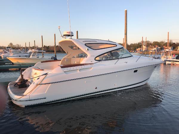 Jeanneau Prestige 34 Hardtop 2008 Jeanneau Prestige 34 Hardtop yacht docked in a marina at sunset.