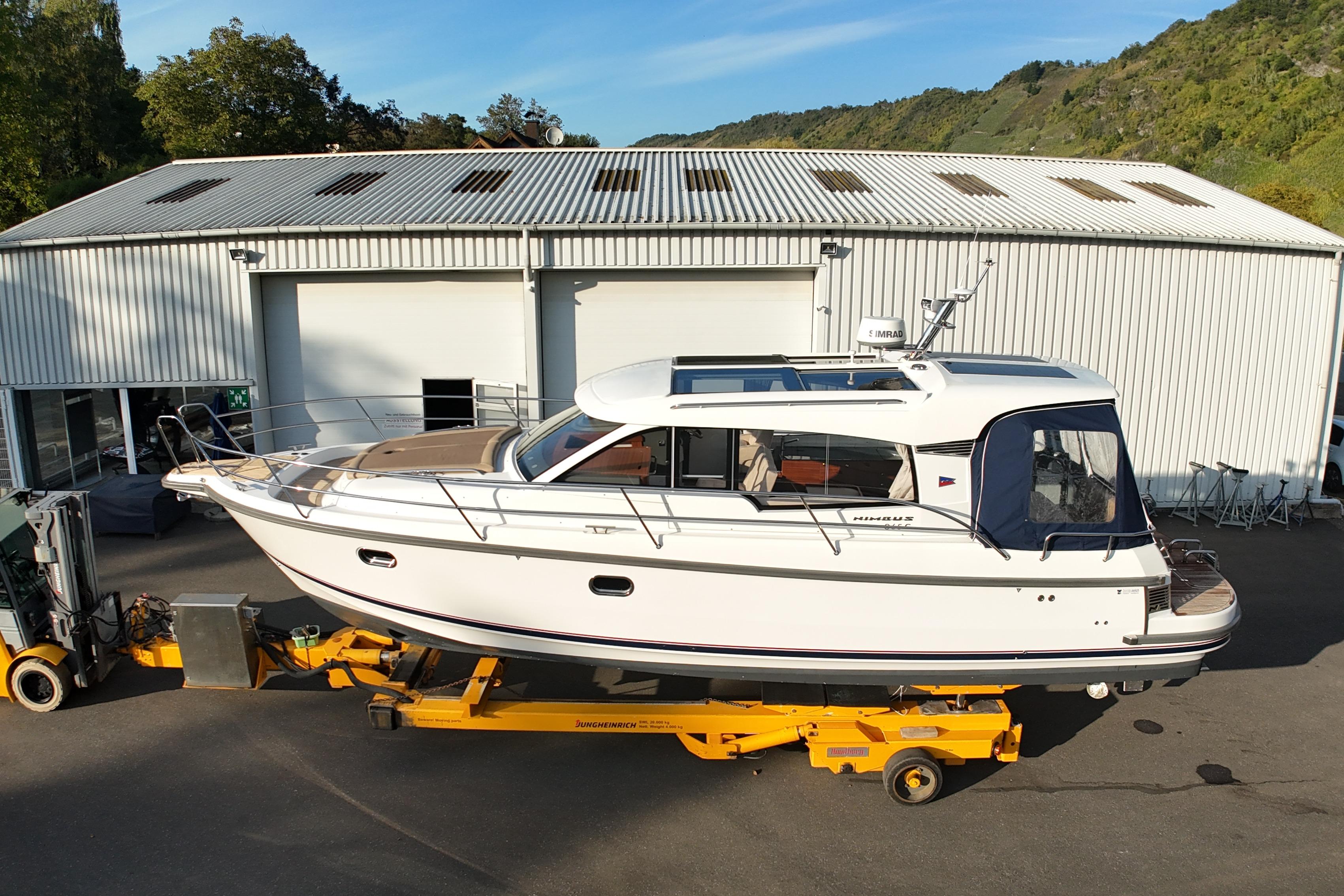 Nimbus 365 Coupe 2019 Nimbus 365 Coupe boat on trailer outside industrial building.
