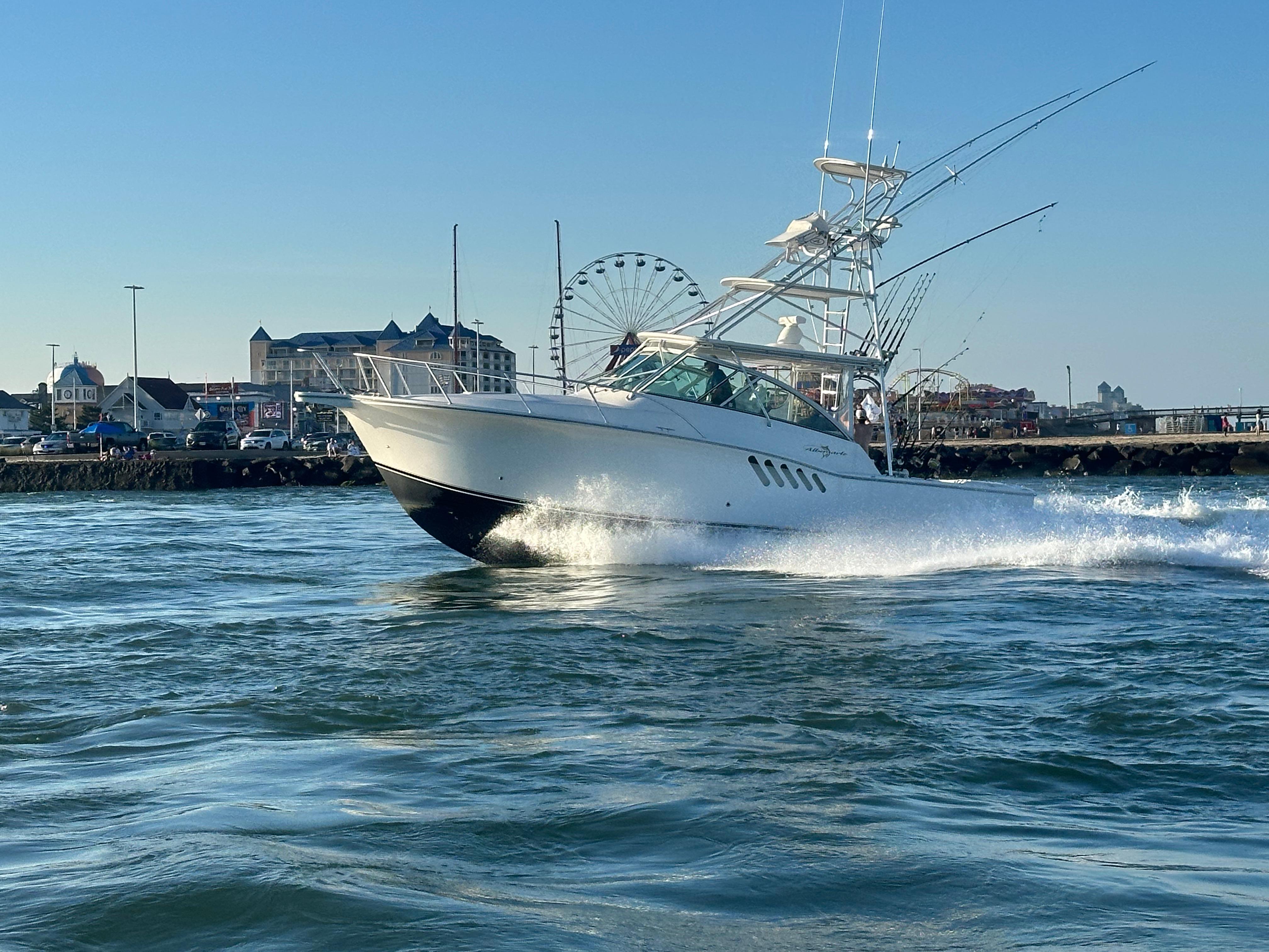 Albemarle 360 Express Fisherman 2014 Albemarle 360 Express Fisherman cruising near a coastal town with a Ferris wheel.