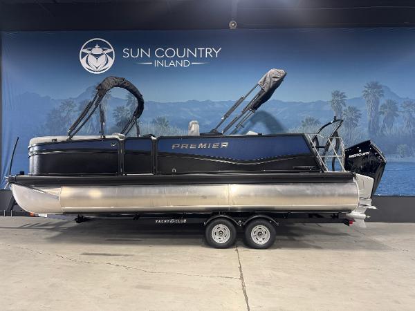 Premier 230 Solaris RL 2025 Premier 230 Solaris RL pontoon boat on trailer at Sun Country Inland showroom.