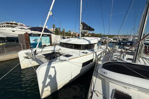 Lagoon 40 2020 Lagoon 40 catamaran docked at a marina under clear blue skies.
